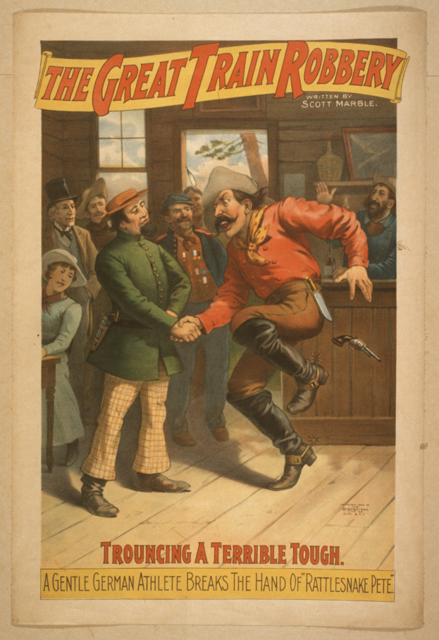 Ein Plakat zeigt eine Gruppe von Menschen auf einem Boden, einer hält eine Waffe, mit Text oben und unten: "Der große Zugraub - Trouching a Terrible Tough".