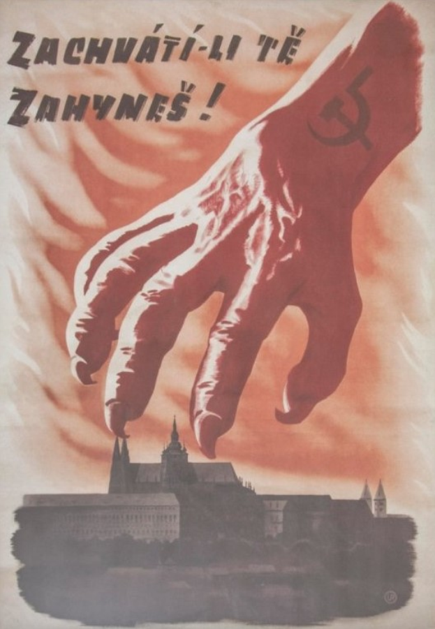 Eine Hand mit einem Hammer und Sichel erreicht ein Gebäude mit der Aufschrift "Zachvati-li te zanynes" oben, was Dringlichkeit und Gefahr suggeriert.